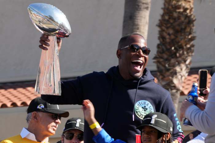 Feb 16, 2022; Los Angeles, CA, USA; Los Angeles Rams defensive coordinator Raheem Morris holds the Vince Lombardi trophy during Super Bowl LVI championship rally at the Los Angeles Memorial Coliseum. Mandatory Credit: Kirby Lee-USA TODAY Sports